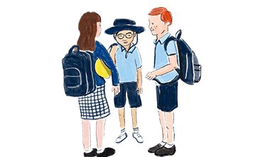 Three school children talking in a circle